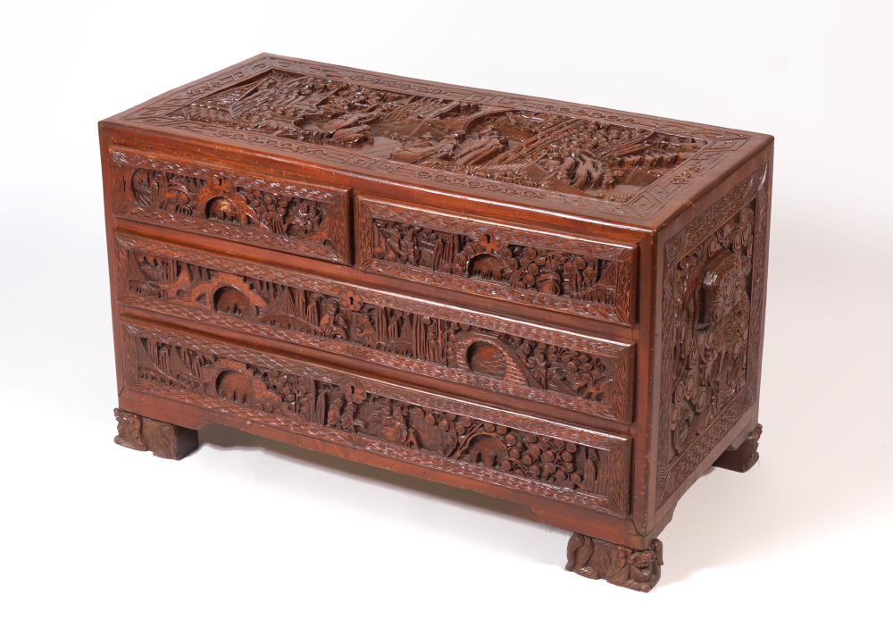 CARVED CHINESE LOW CHEST Profusely carved all over with oriental