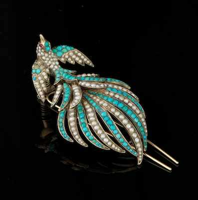 A Victorian Turquoise and Seed Pearl Brooch Stylized peacock design