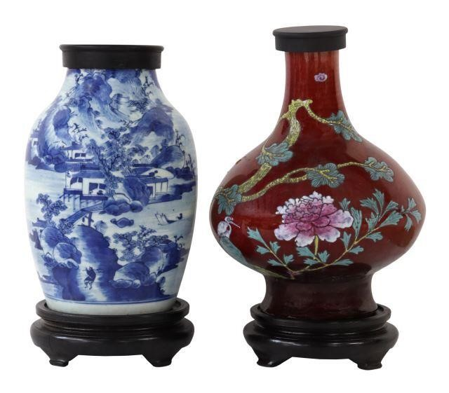 lot of 2 Chinese porcelain lidded vases rising on wood