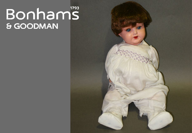 An Armand Marseille painted bisque head character baby with brown