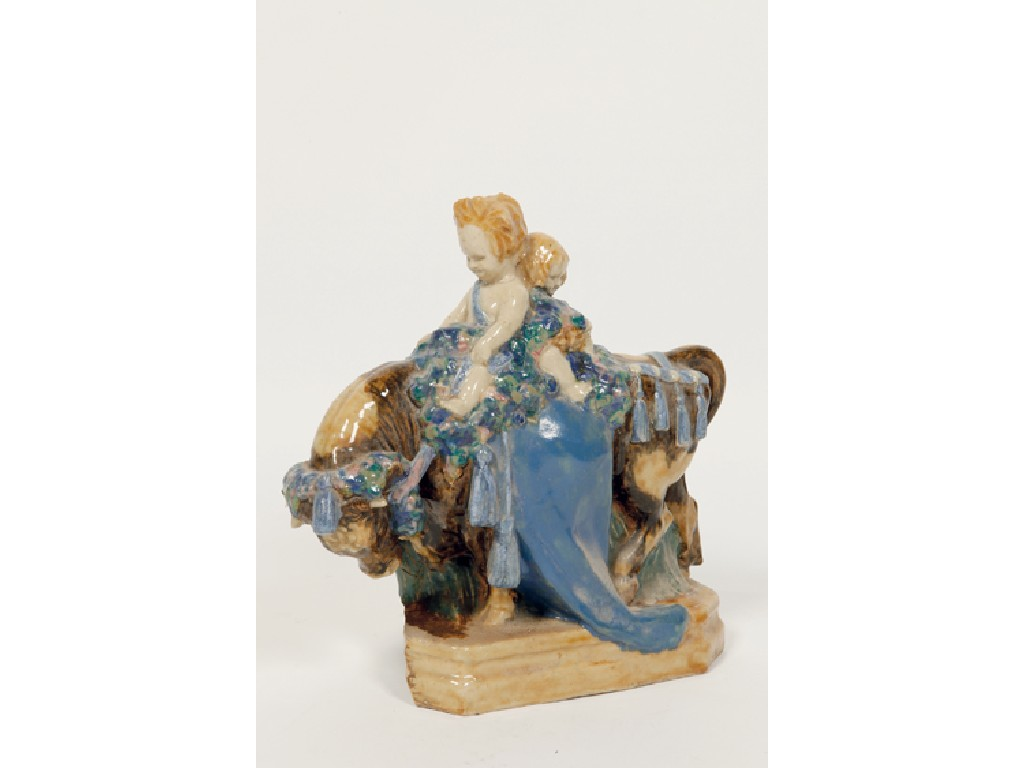 HAROLD STABLER A pottery model of two cherubic children riding