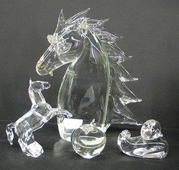 An assembled grouping of glass animals and paperweights Comprising a