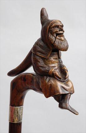 ENGLISH SILVER MOUNTED WALNUT CANE WITH NUTCRACKER HANDLE In the