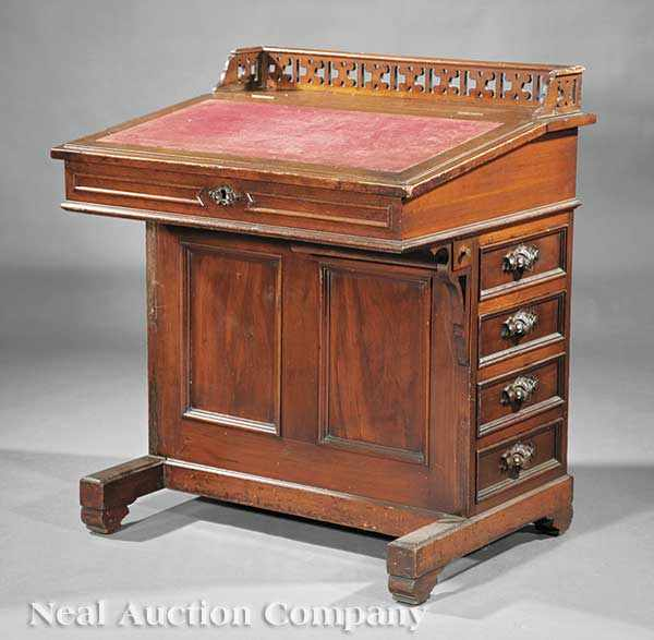 An American Carved Walnut Davenport Desk mid 19th c reticulated