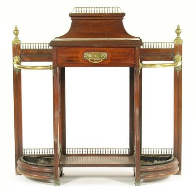 A late Victorian walnut and brass mounted hall stand attributed