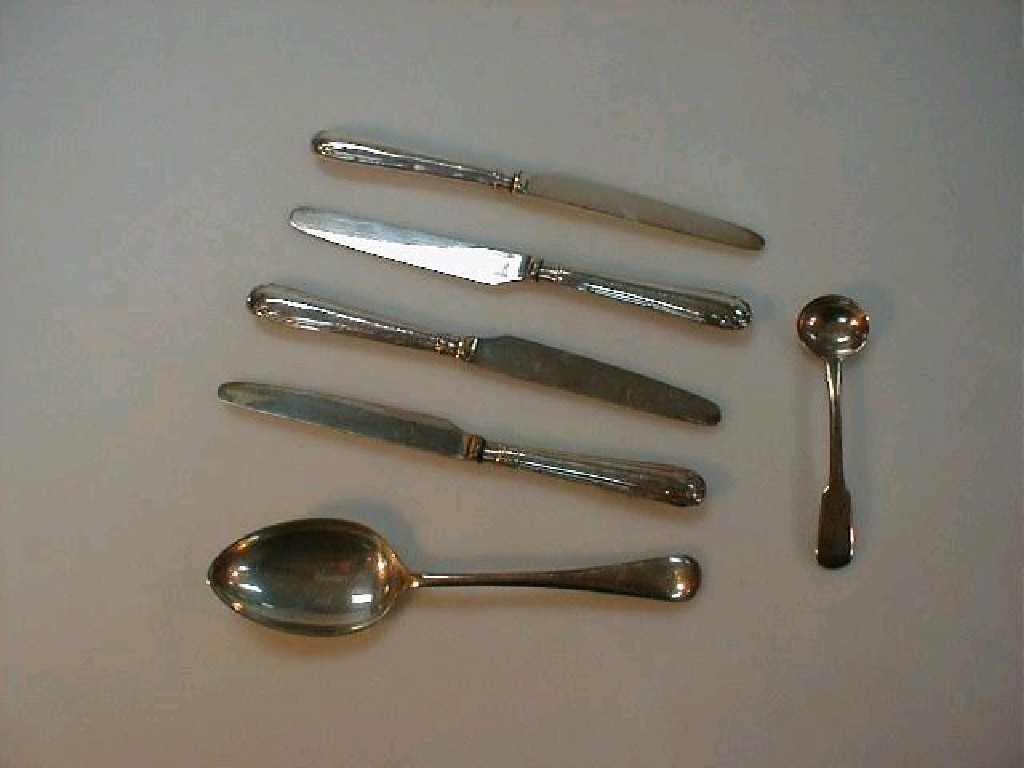 Four silver handled tea knives an Old English pattern dessert