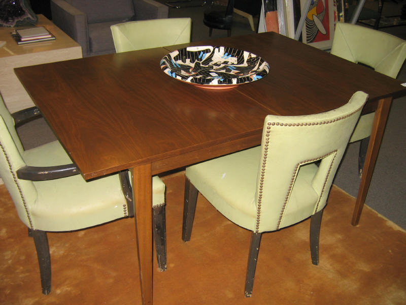 DUNBAR BERNE INDIANA Walnut dining table raised on tapering legs