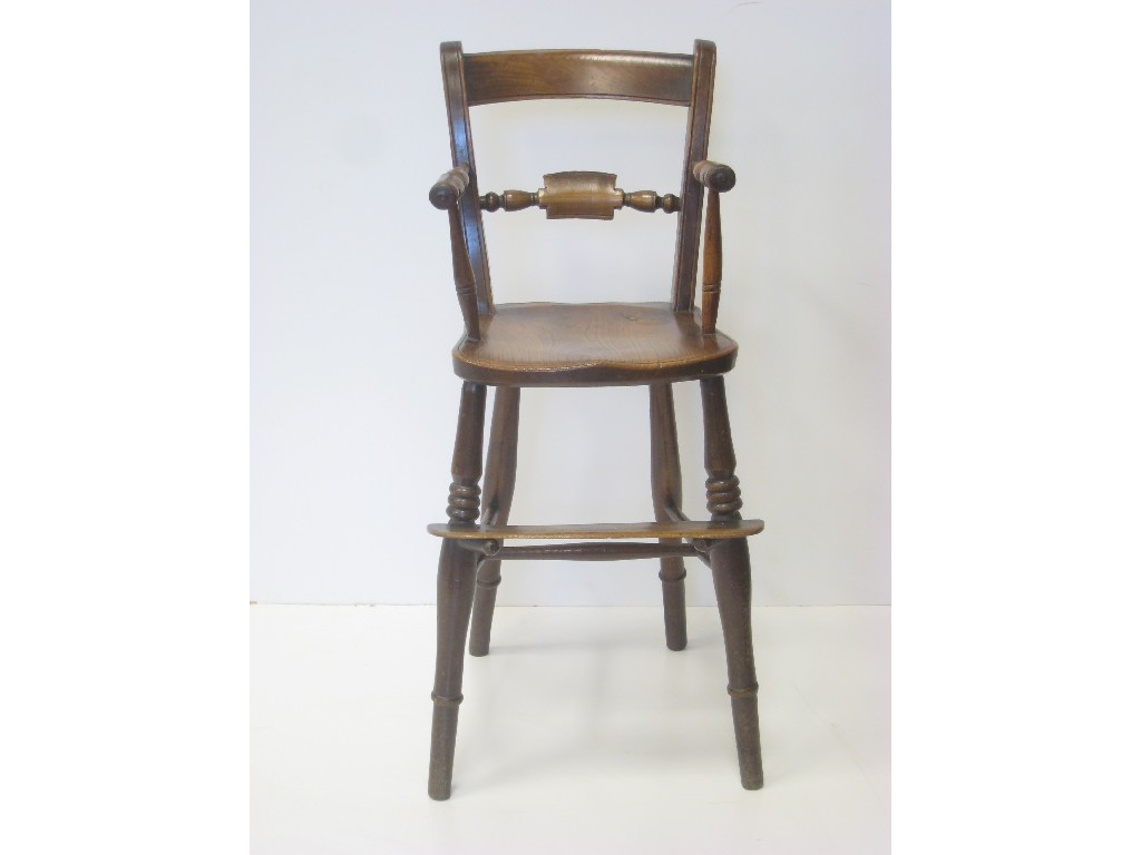 A Child s antique elm High Chair with rail back