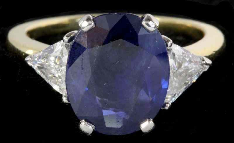 Platinum Gold and Sapphire and Diamond Ringcentering on one oval