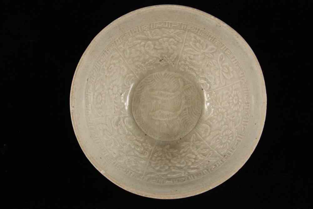 CHINESE CELADON BOWL Chinese Celadon Bowl with cast decoration of
