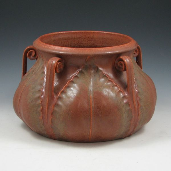 Ephraim Fiddlehead Jardiniere in matte brown with green highlights from