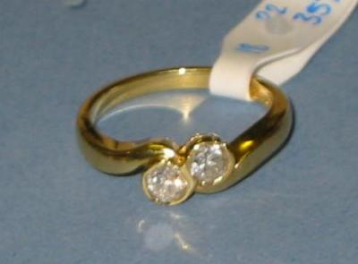 A TWO STONE DIAMOND RING the brilliant cut stones on