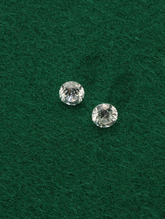 Two Unmounted Diamonds Each brilliant cut the first weighing exactly
