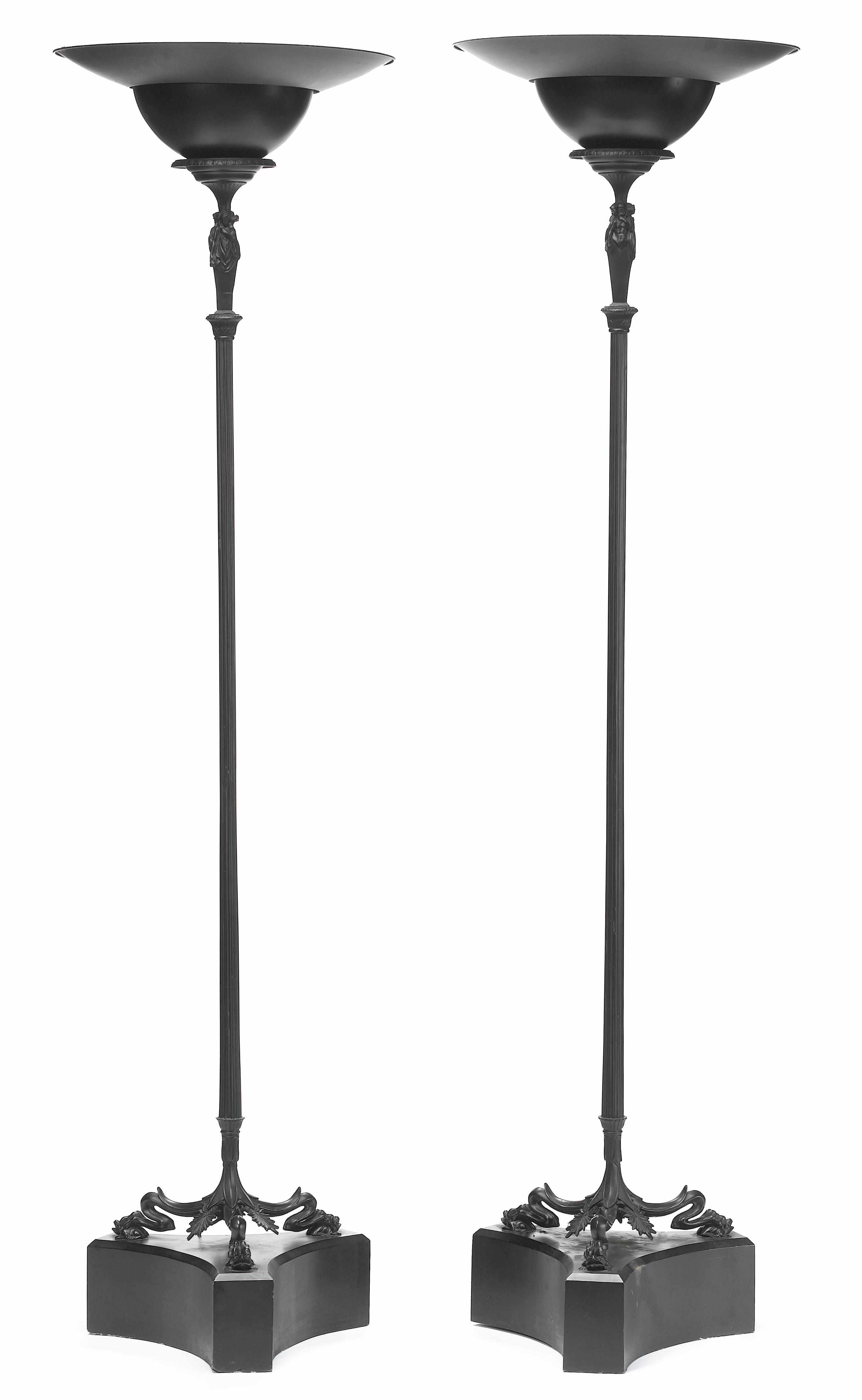 A pair of Pompeian style patinated metal floor lamps 20th