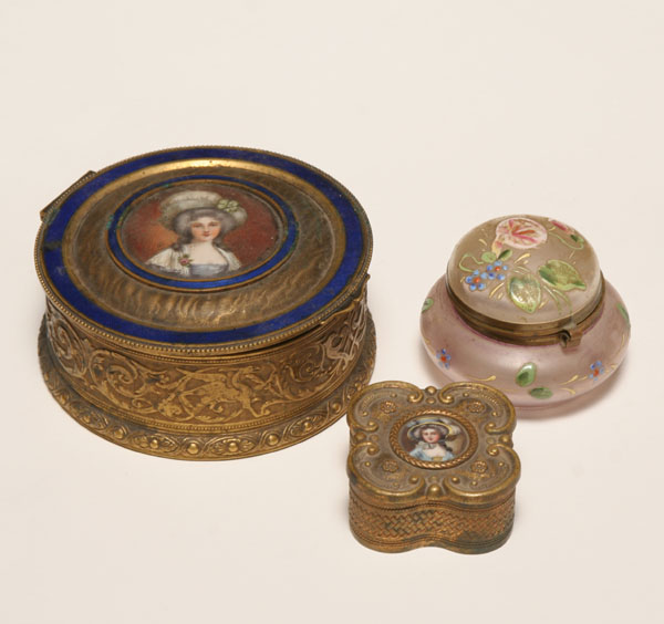 Two early metal boxes and one glass jar one embossed