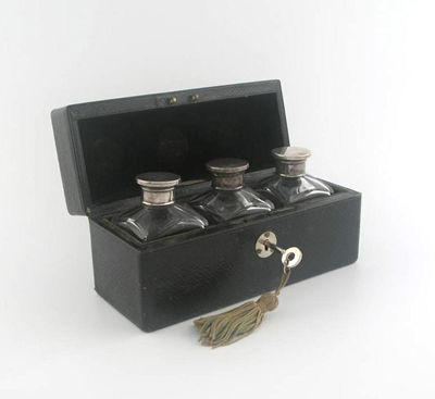 A set of three FLORIS perfume bottles with plated screw