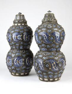 Near pair of Moroccan metal Early 20th century each surmounted