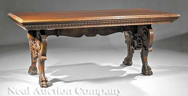 A Renaissance Style Carved Walnut Library Table molded top dentilated