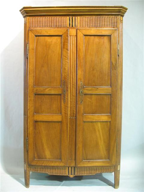CONTINENTAL NEOCLASSICAL WALNUT ARMOIRE Late 18th century the molded cornice