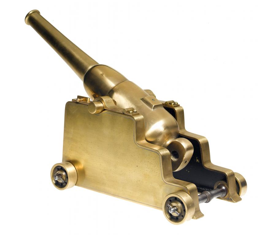 A BRONZE MODEL OF A HOWITZER on bronze carriage with