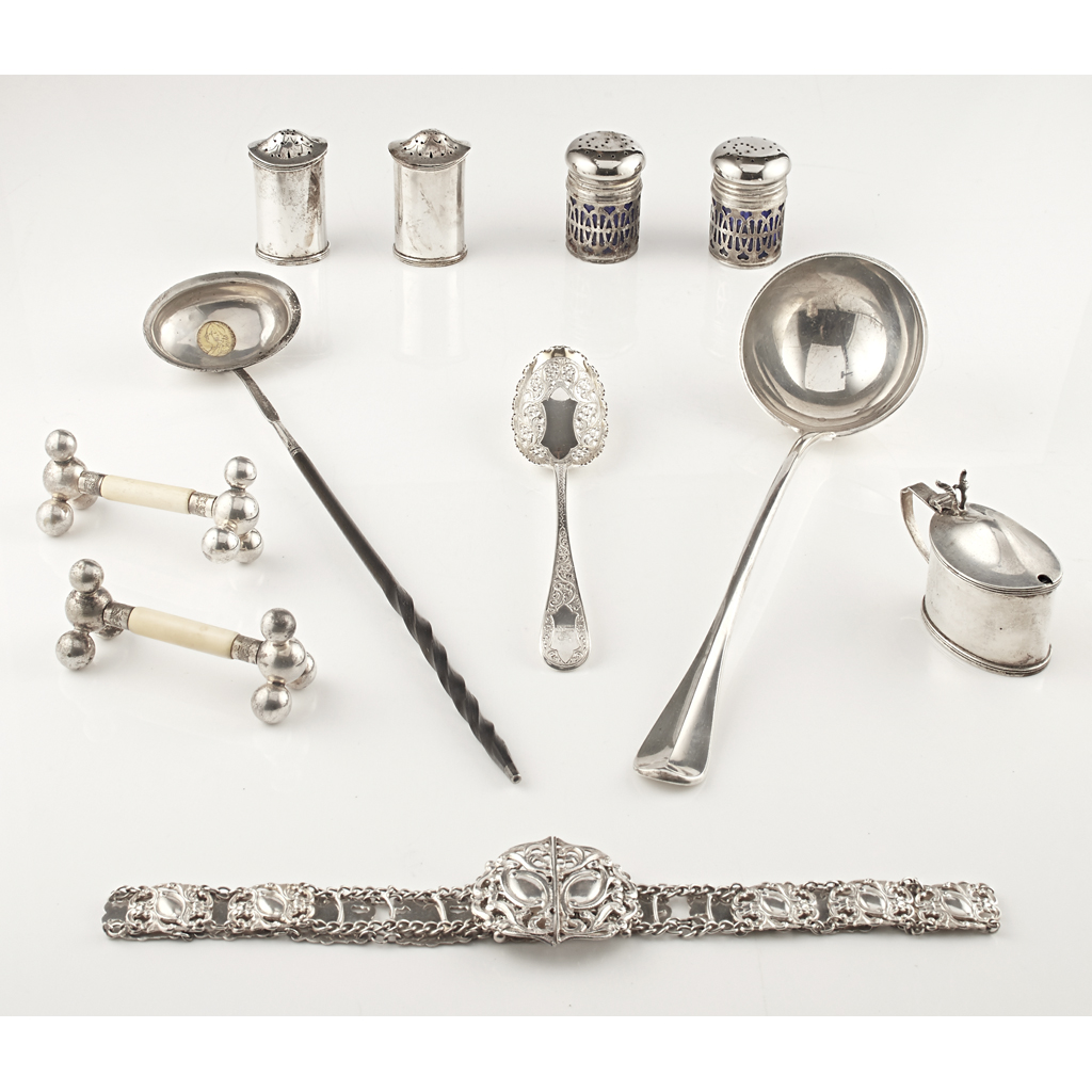 A collection of silver to include a soup ladle George