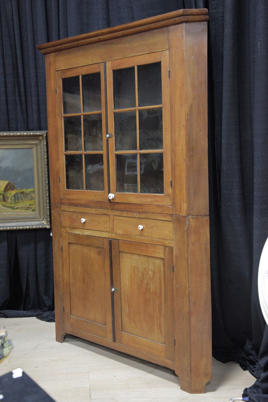 CORNER CUPBOARD Walnut square nail constucted cupboard having a stepped