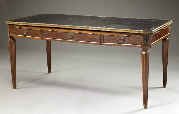 A Louis XVI style gilt bronze mounted mahogany bureau plat