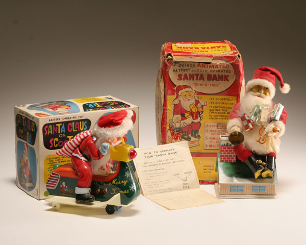 Two boxed Japanese vintage tin litho battery operated Santa toys