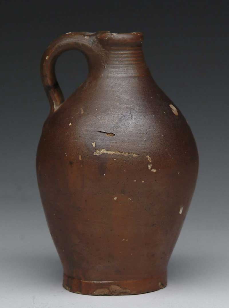 MINIATURE HANDLED OVOID REDWARE JUG Neck with ribs unmarked SIZE