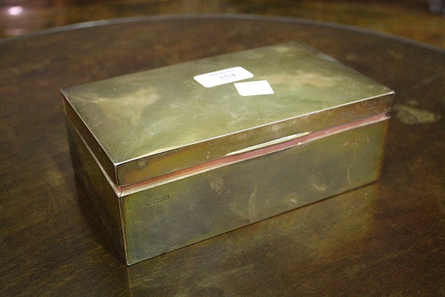 A SILVER CIGARETTE BOX of plain form Chester 1911