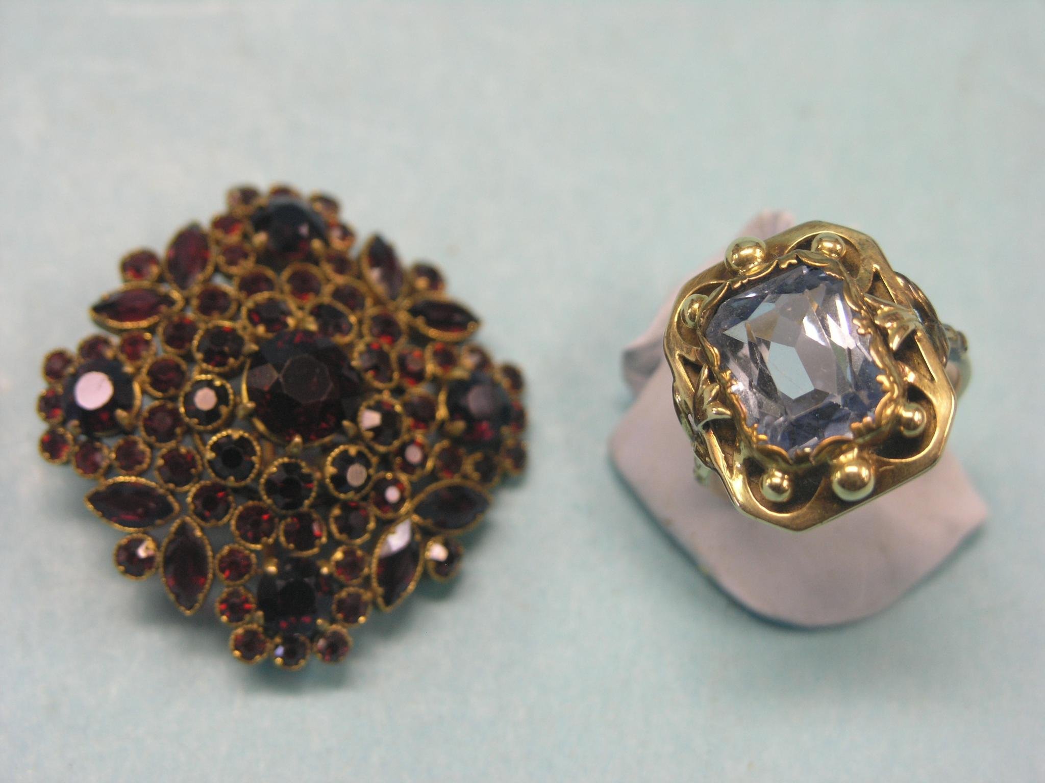 A 14ct gold dress ring step cut aquamarine within carved