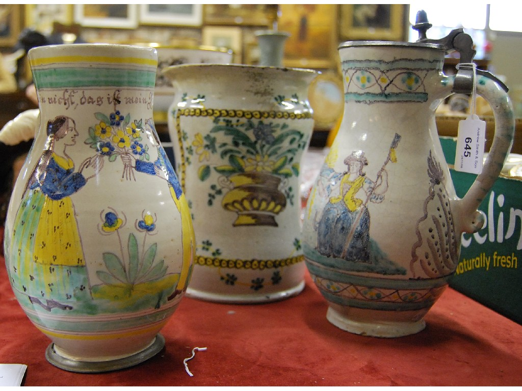 A 19th century German faience jug the pewter hinged cover