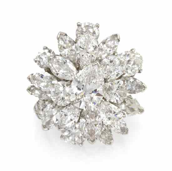 A Vintage Platinum and Diamond Cluster Ring containing one pear