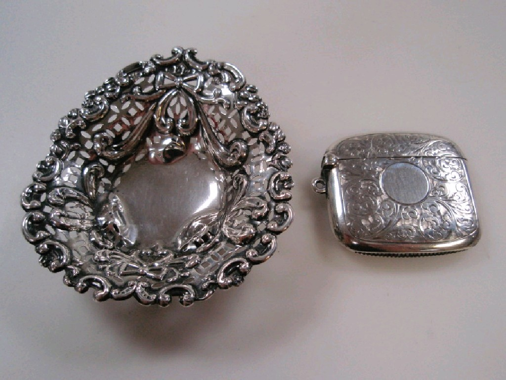A silver vesta case Birmingham 1911 together with a pierced