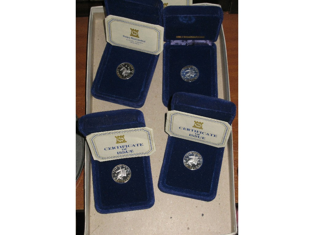 Lot comprising four proof 1 coins