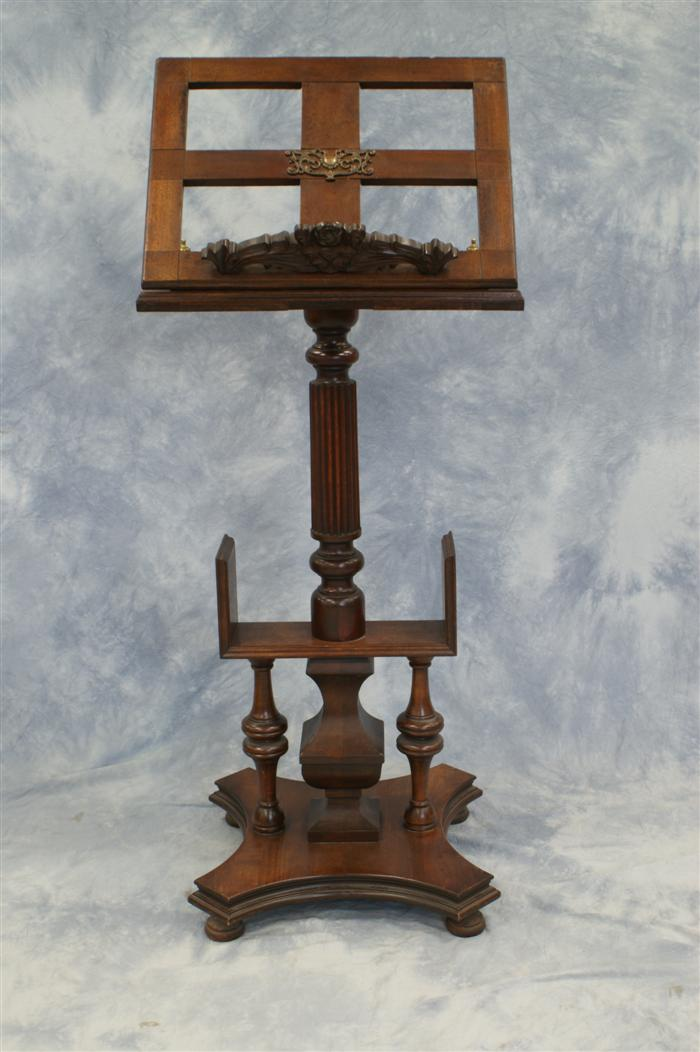 Carved mahogany Victorian bookstand with adjustable top with a leather