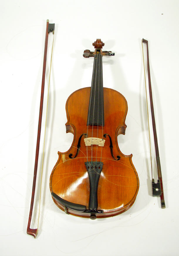 Violin and two bows the violin with paper label marked