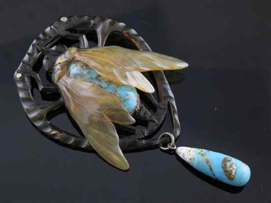 A continental Art Nouveau turquoise mounted horn bug brooch of