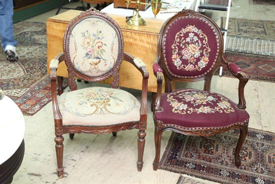 TWO ARMCHAIRS Similar French style chairs with carved features and