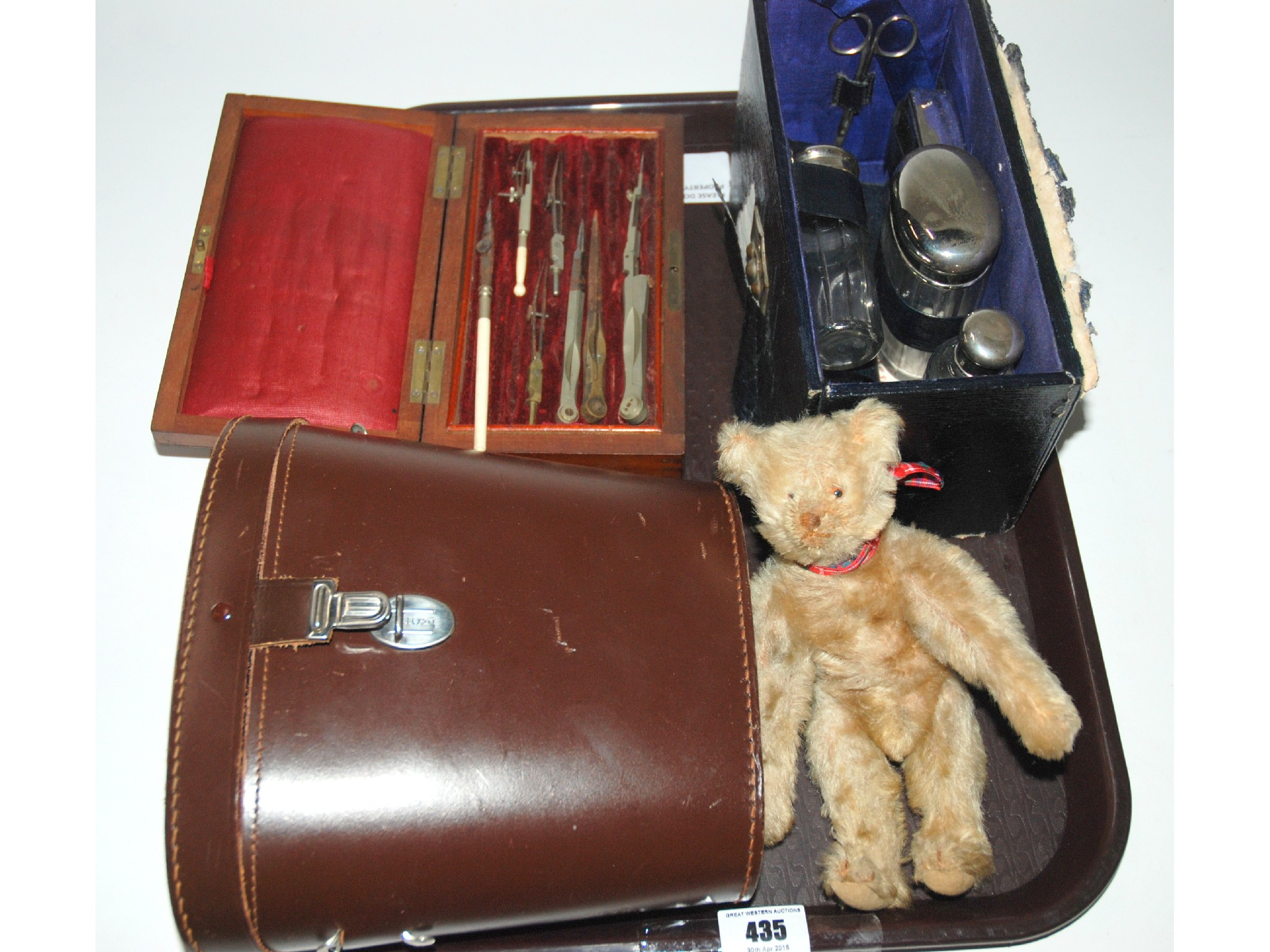 A pair of binoculars cased drawing set white metal mounted