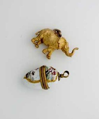 A modern 9ct gold trumpeting elephant charm and an early