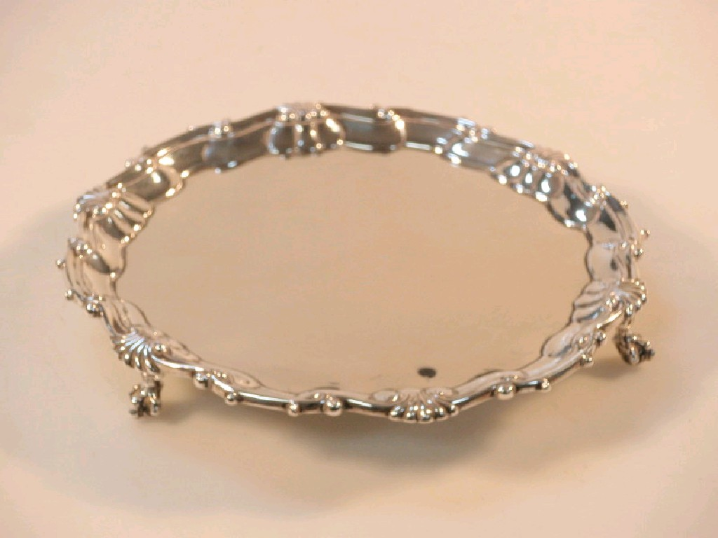 A late Victorian silver waiter with pie crust and shell