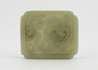 A Chinese pale celadon jade rectangular belt buckle carved with