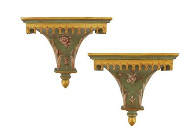 A pair of green painted pine wall brackets decorated with