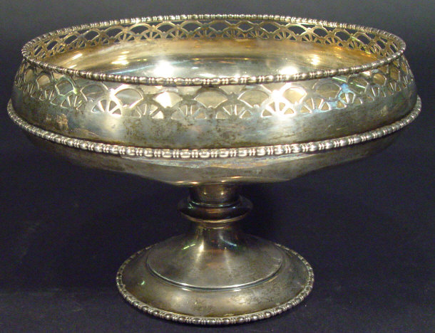 Circular silver pedestal bowl with pierced rim by Walker and