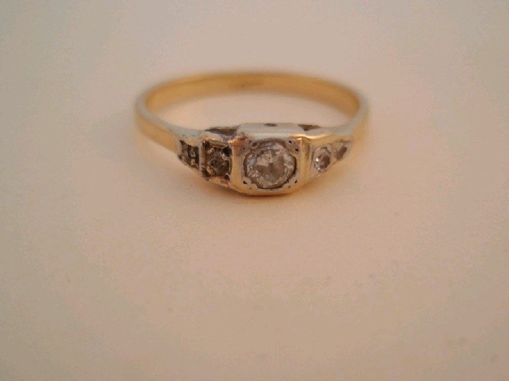 A small diamond set dress ring shank stamped 18ct stone
