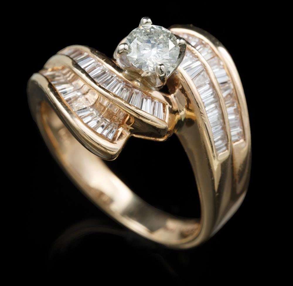 14 kt Yellow Gold and Diamond Ring center prong set