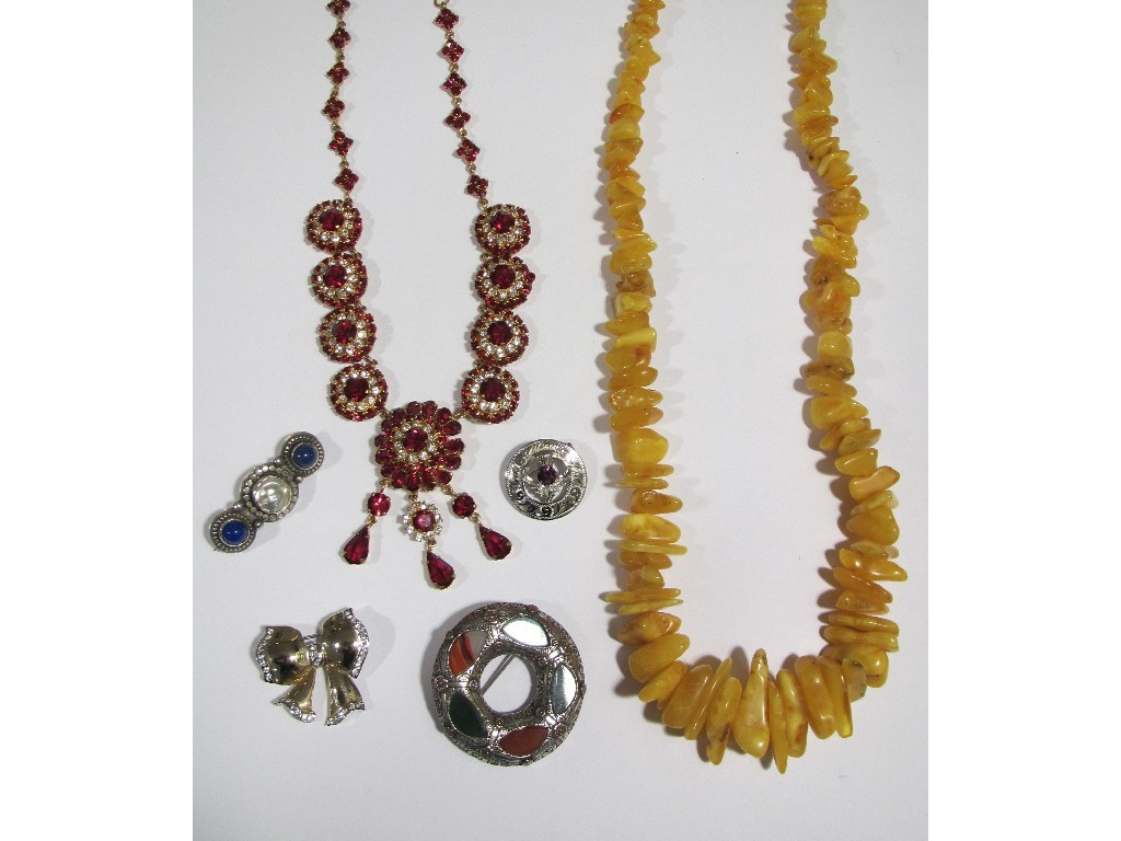 Assorted costume jewellery to include an amber necklace Dior style