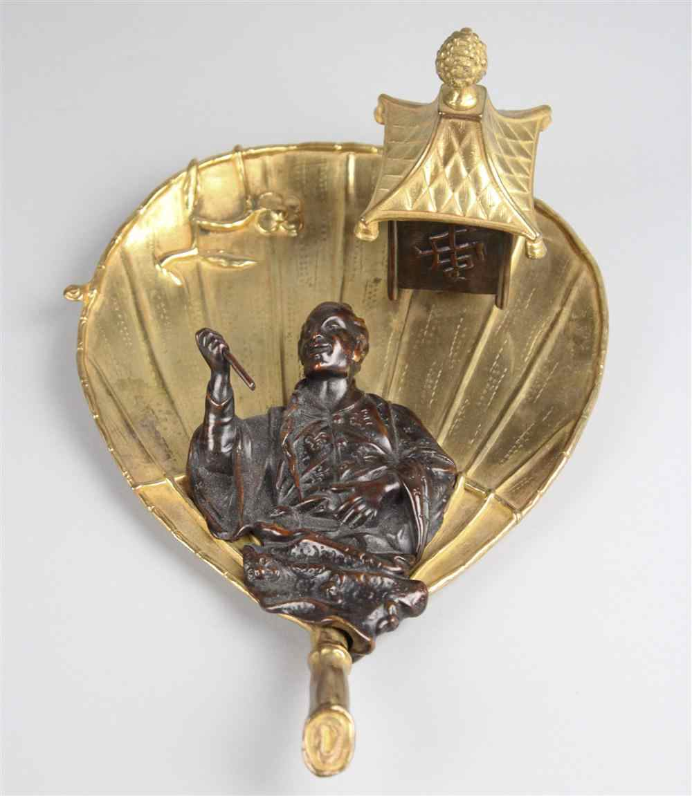 A JAPONAISERIE BRONZE MOUNTED BRASS INKSTAND formed as a Japanese
