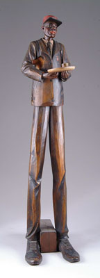 36 WOOD CARVED BLACK RED CAP This well attired gentleman